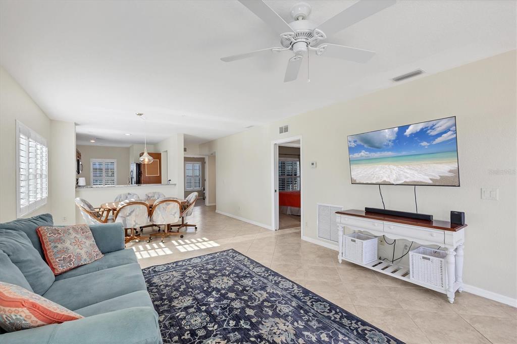 8413 Placida Road, Unit 308 Placida, FL 33946 - Photo 8 of 40 a living room with furniture and a rug