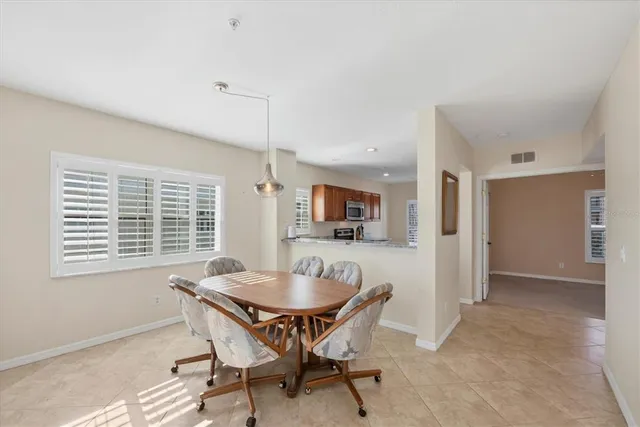 a view of a dining room with furniture and window