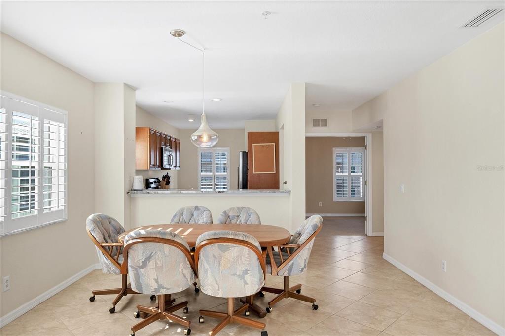 8413 Placida Road, Unit 308 Placida, FL 33946 - Photo 10 of 40 a dining room with furniture and window