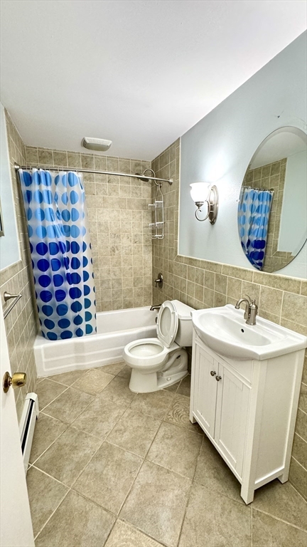 31 Arlington Road, Unit 6 Woburn, MA 01801 - Photo 13 of 26 a bathroom with a sink and a mirror