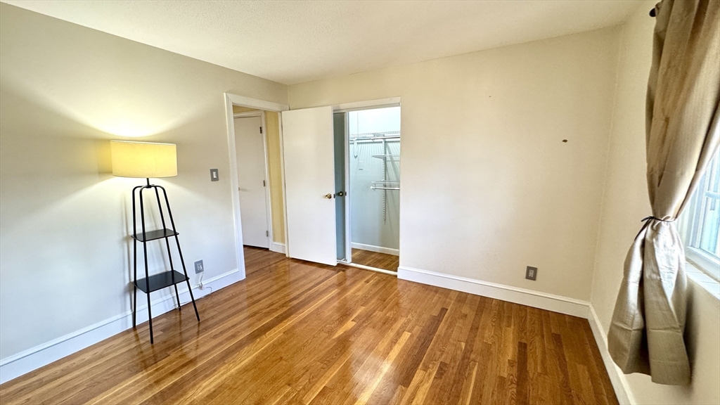 31 Arlington Road, Unit 6 Woburn, MA 01801 - Photo 15 of 26 a view of a room with wooden floor and stairs