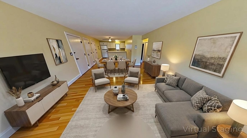 31 Arlington Road, Unit 6 Woburn, MA 01801 - Photo 4 of 26 a living room with furniture and a flat screen tv