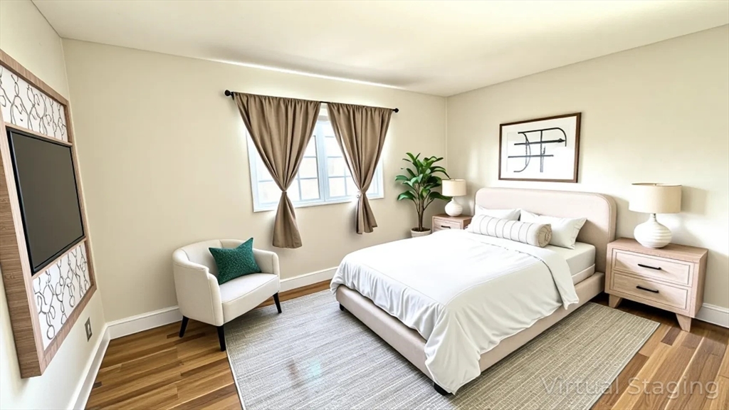 31 Arlington Road, Unit 6 Woburn, MA 01801 - Photo 5 of 26 a bedroom with bed and a couch