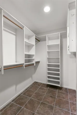 a living room with furniture a flat screen tv and a window