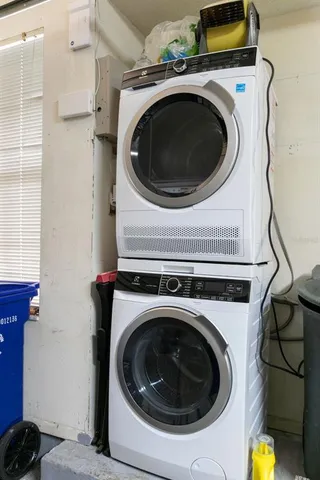 a view of a yard in front of a tree