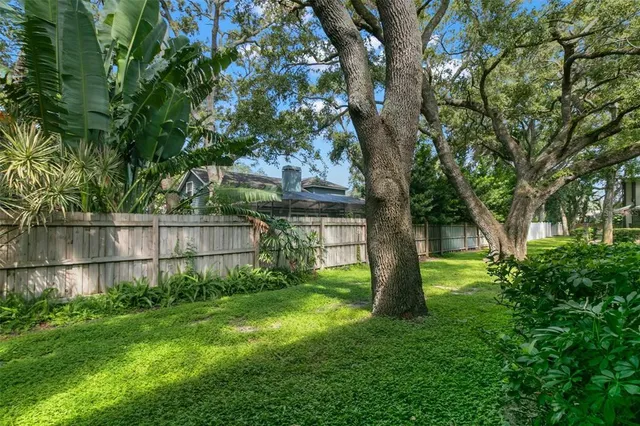 an aerial view of a house with outdoor space pool seating area and yard