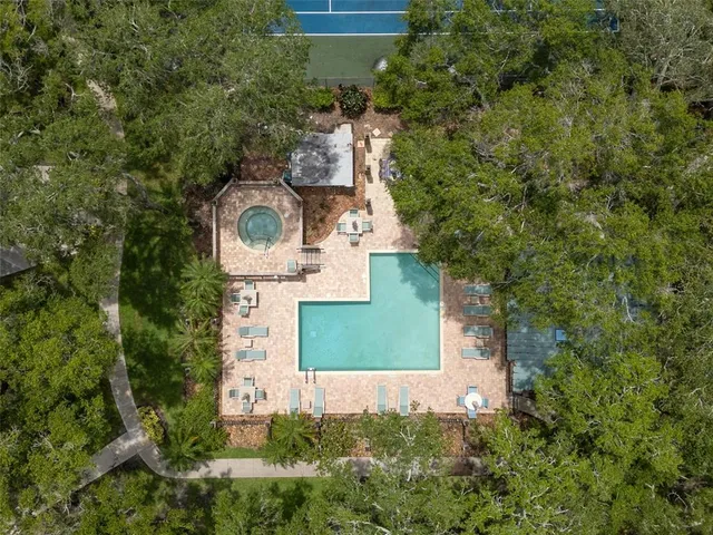 a view of a swimming pool with a patio