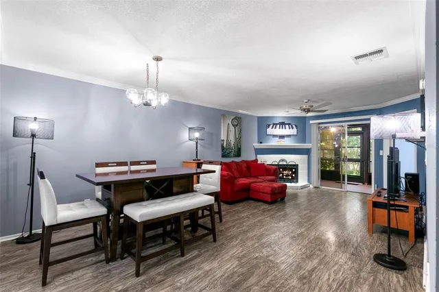 a living room with furniture a window and a flat screen tv