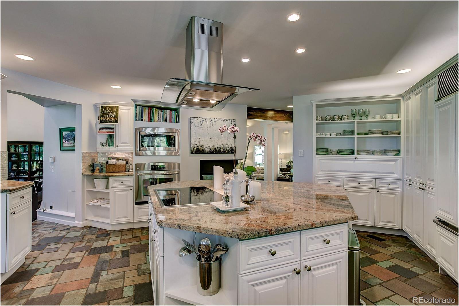 1559 Kerr Gulch Road Evergreen, CO 80439 - Photo 12 of 34 a kitchen with stainless steel appliances granite countertop a sink and stove