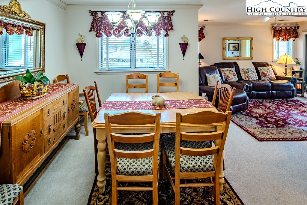 151 Deer Valley Drive, Unit 231 Boone, NC 28607 - Photo 14 of 35 a view of a dining room with furniture and a window