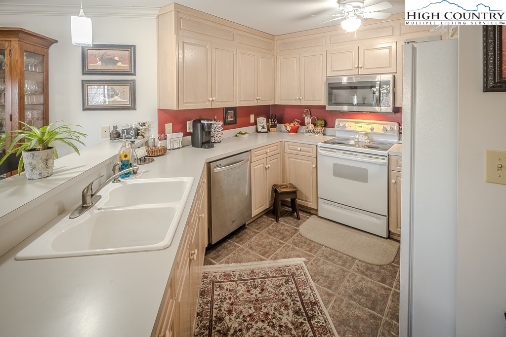 151 Deer Valley Drive, Unit 231 Boone, NC 28607 - Photo 16 of 35 a utility room with cabinets washer and dryer