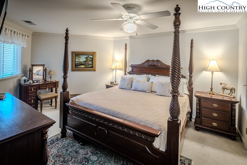 151 Deer Valley Drive, Unit 231 Boone, NC 28607 - Photo 20 of 35 a bedroom with a bed a desk and chair