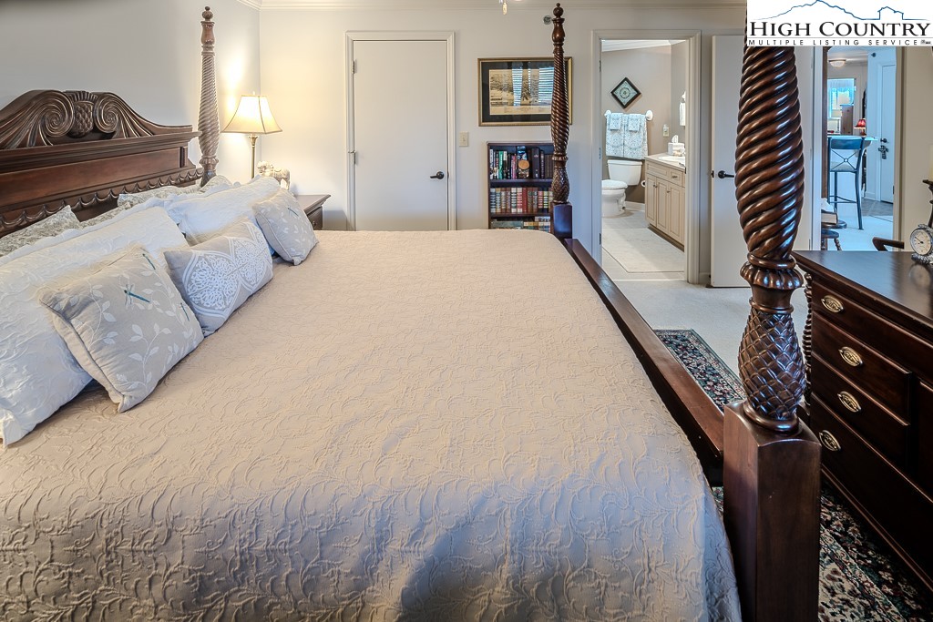 151 Deer Valley Drive, Unit 231 Boone, NC 28607 - Photo 22 of 35 a bedroom with a bed next to a window