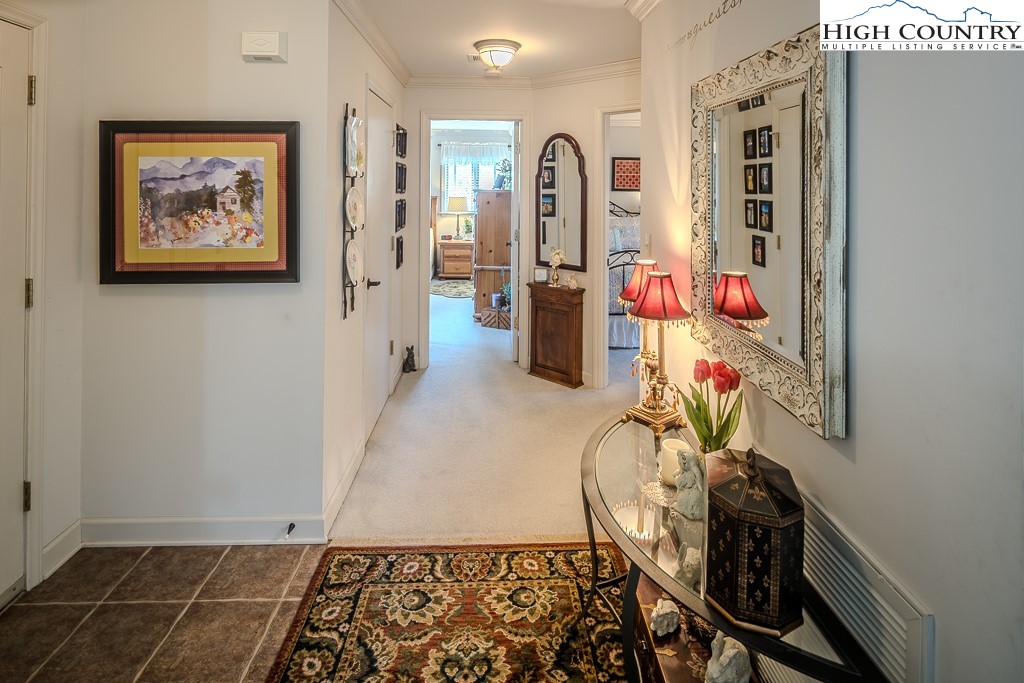 151 Deer Valley Drive, Unit 231 Boone, NC 28607 - Photo 24 of 35 a view of a hallway with furniture and a potted plant