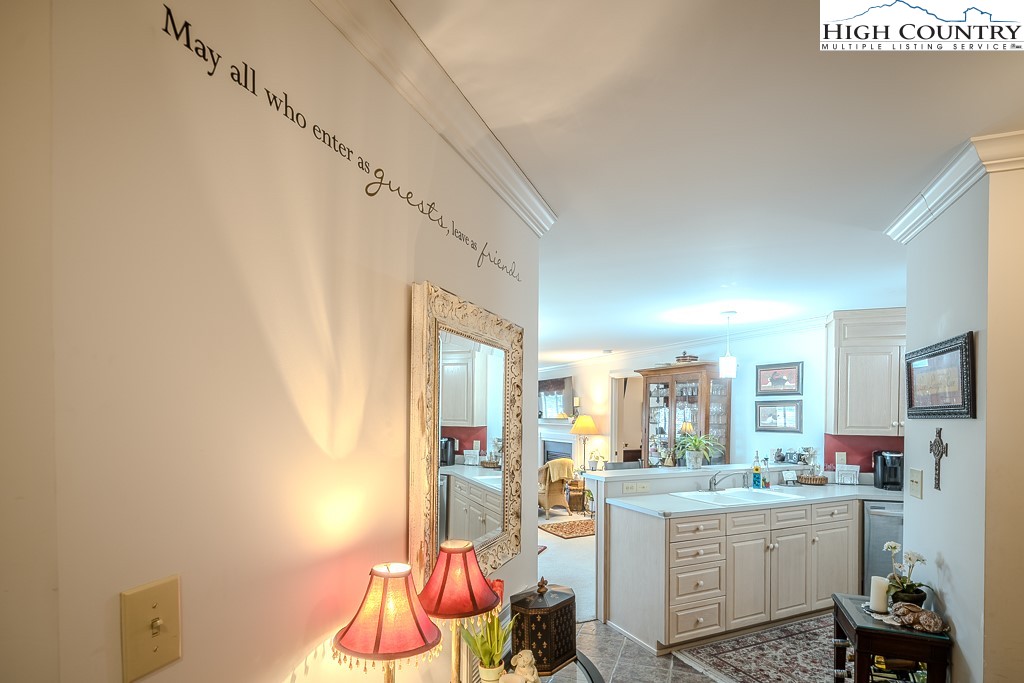 151 Deer Valley Drive, Unit 231 Boone, NC 28607 - Photo 26 of 35 a room with kitchen island a white cabinets and sink