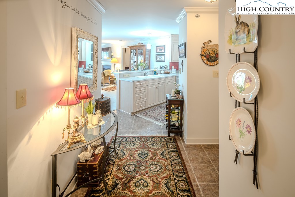 151 Deer Valley Drive, Unit 231 Boone, NC 28607 - Photo 27 of 35 a room with chandelier fan and wooden floor