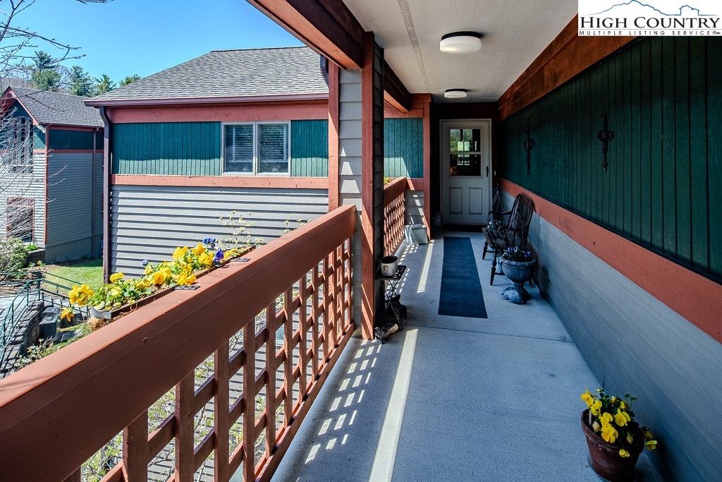 151 Deer Valley Drive, Unit 231 Boone, NC 28607 - Photo 4 of 35 a balcony view with two chairs and a table