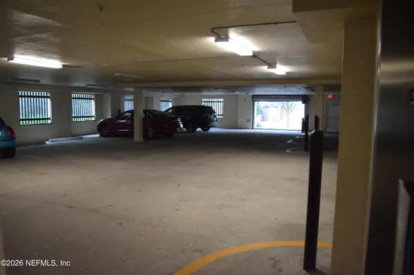 a view of a room with gym equipment and windows