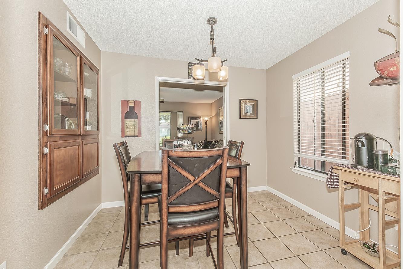 1908 East Niles Avenue Fresno, CA 93720 - Photo 7 of 30 a dining room with furniture and window