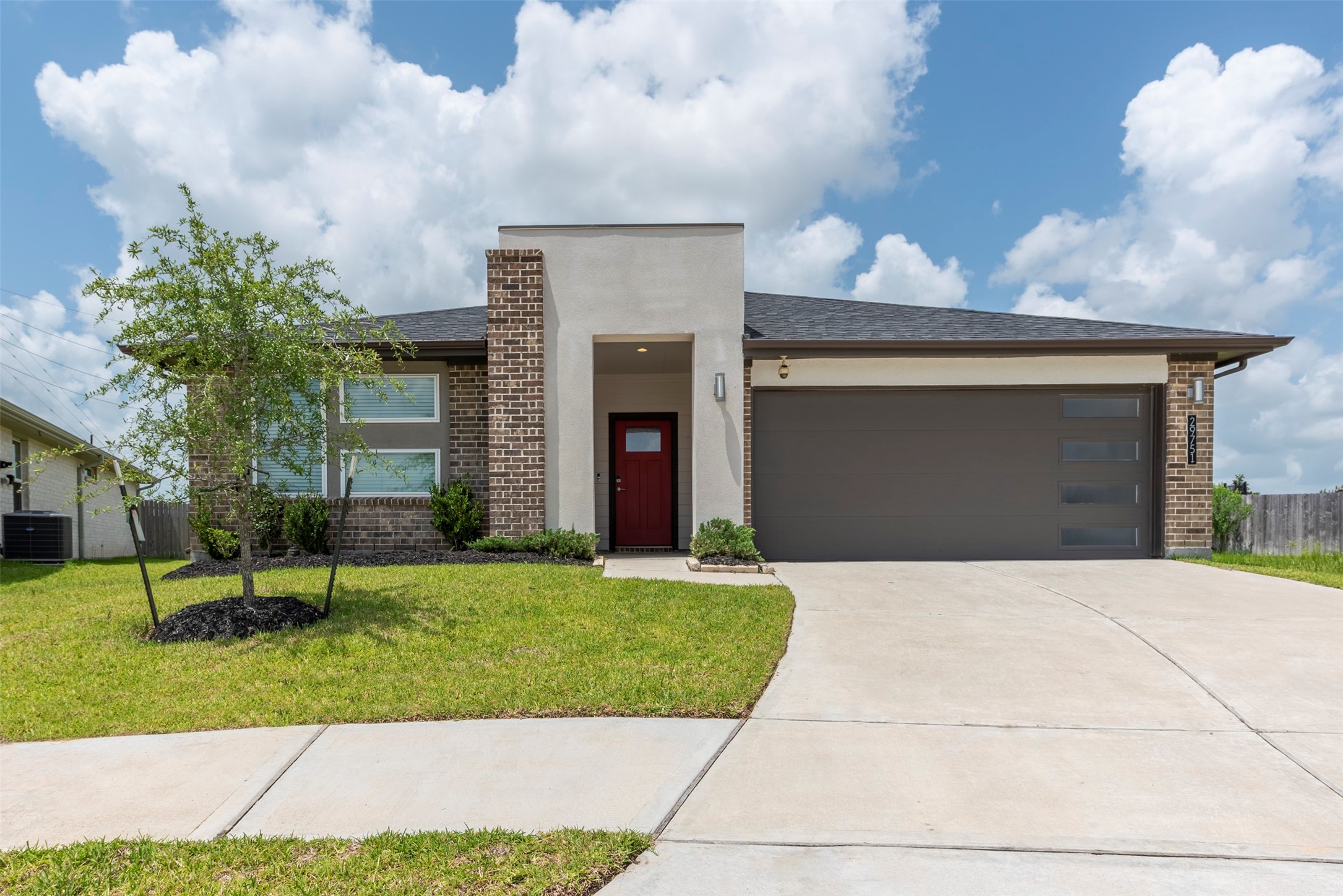 29751 Cayenne Circle Katy, TX 77494 - Photo 1 of 36 a front view of a house with a yard and garage