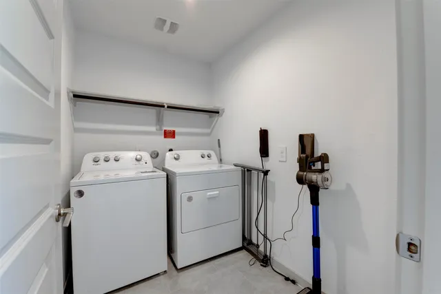 a kitchen with a refrigerator and a sink