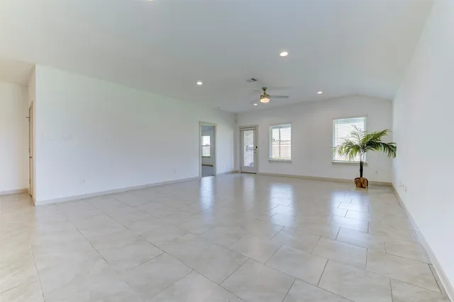 a view of an empty room and window