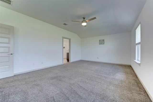 a view of an empty room with a fan