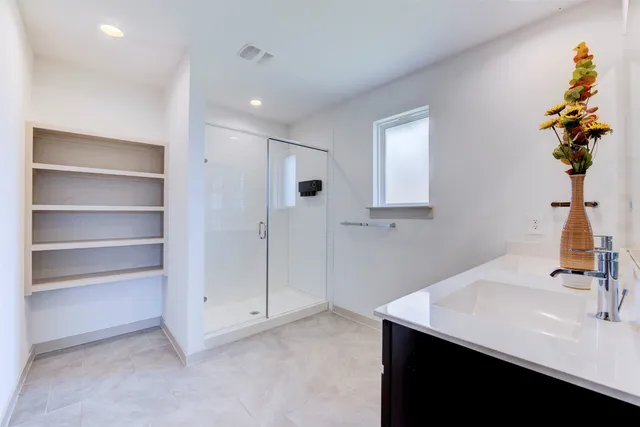 a bathroom with a sink a vanity and a mirror