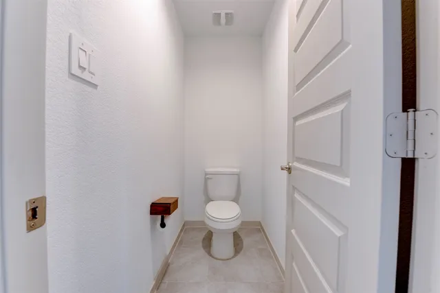 a bathroom with a toilet and a sink