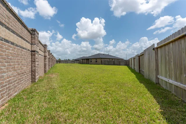 a view of swimming pool in front of house
