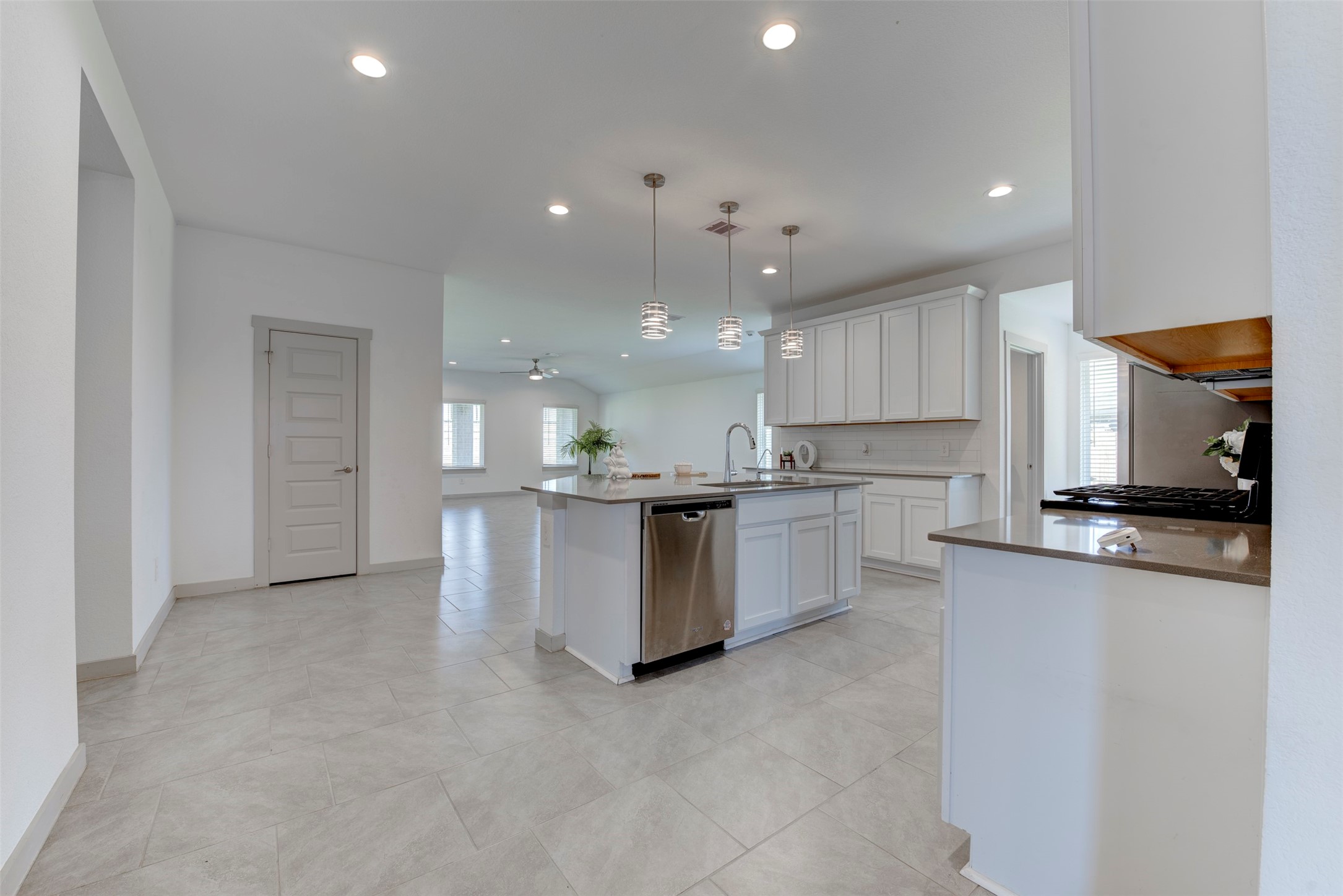 29751 Cayenne Circle Katy, TX 77494 - Photo 36 of 36 a large kitchen with stainless steel appliances kitchen island a large counter top and a stove top oven