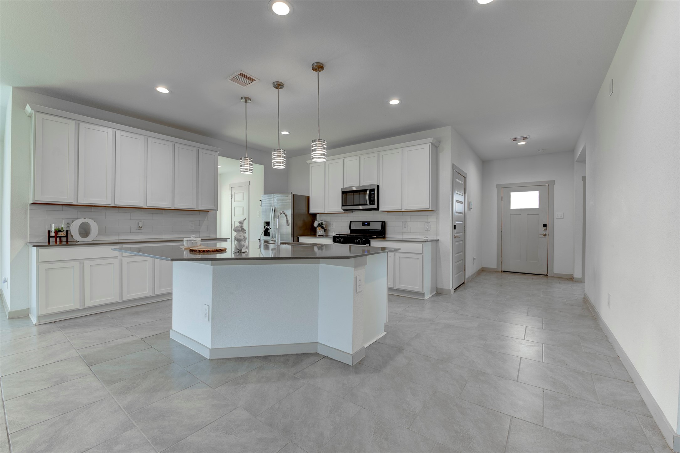 29751 Cayenne Circle Katy, TX 77494 - Photo 8 of 36 a kitchen with white cabinets and white appliances
