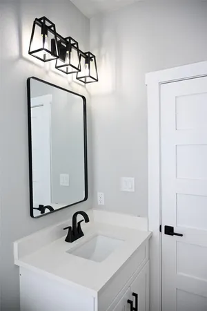 a bathroom with a sink and mirror