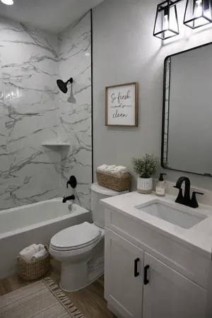 a bathroom with a sink a toilet a mirror and shower