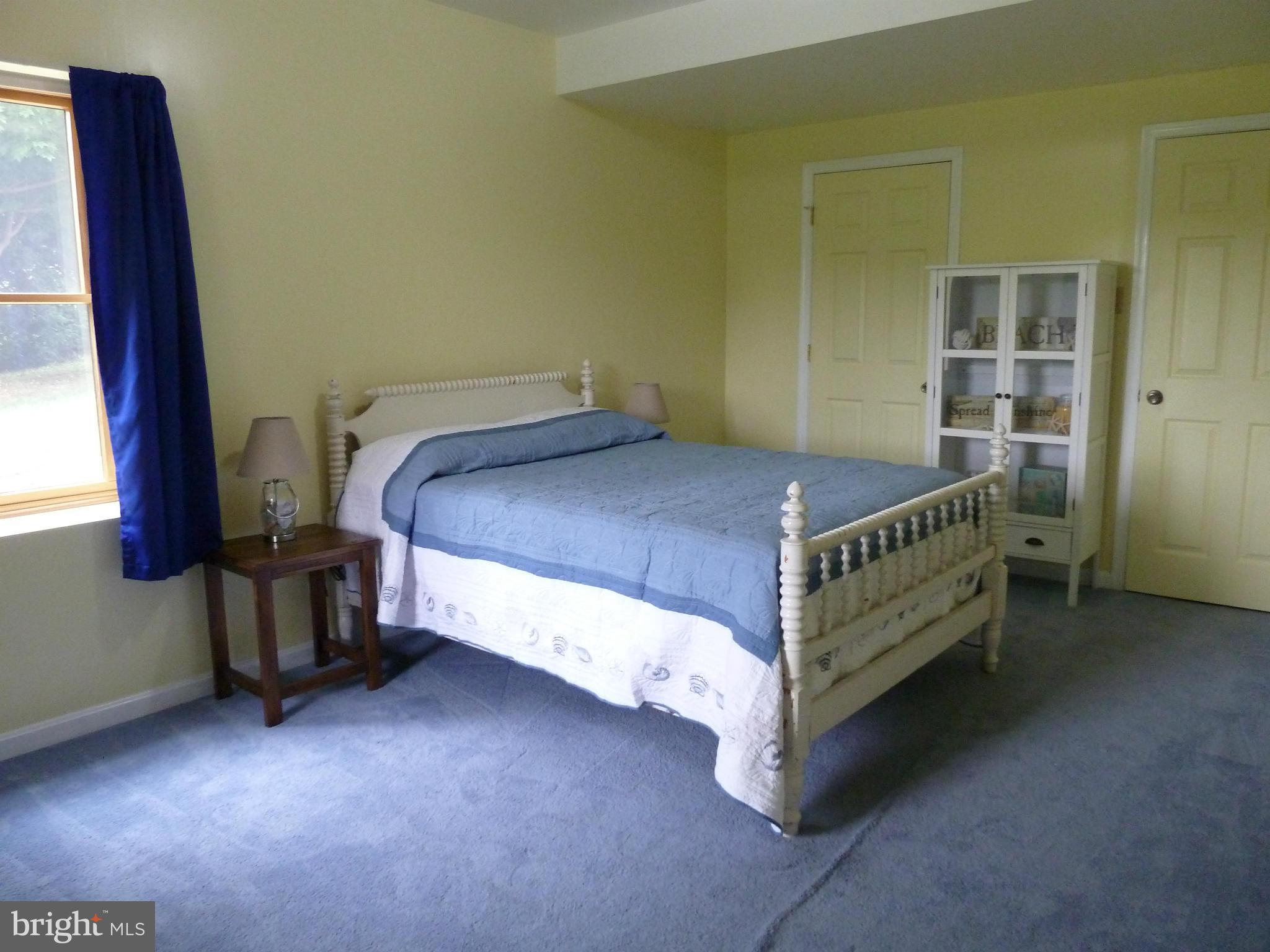 11682 Rocky Meadow Road Clear Spring, MD 21722 - Photo 14 of 30 a bed sitting in a room next to a window