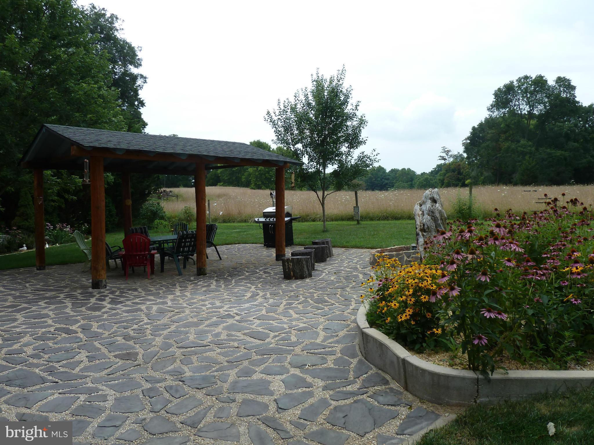 11682 Rocky Meadow Road Clear Spring, MD 21722 - Photo 27 of 30 a view of a patio with chairs and plants