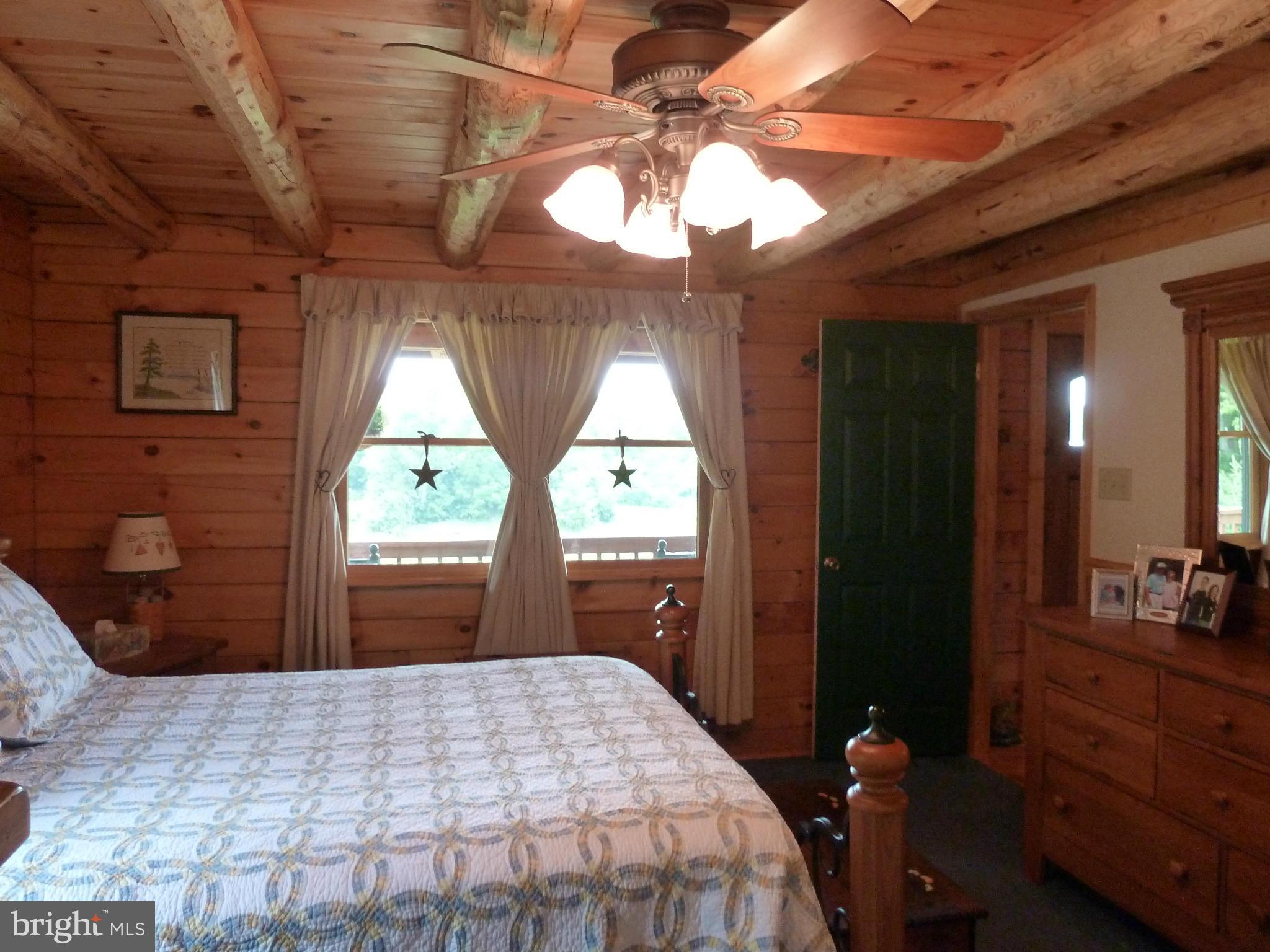 11682 Rocky Meadow Road Clear Spring, MD 21722 - Photo 10 of 30 a bedroom with a bed and a dresser next to a window