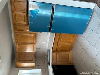 338 Beach 87th Street, Unit 1 Queens, NY 11693 - Photo 3 of 5 a kitchen with a refrigerator and a sink