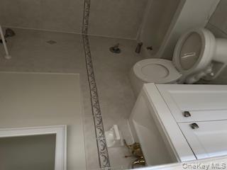 338 Beach 87th Street, Unit 1 Queens, NY 11693 - Photo 5 of 5 a bathroom with a sink a toilet and shower