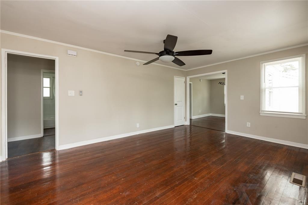 1854 Broadwell Street Southwest Atlanta, GA 30310 - Photo 11 of 18 a view of empty room with wooden floor and window