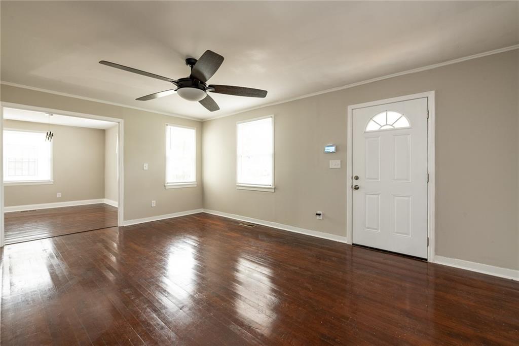 1854 Broadwell Street Southwest Atlanta, GA 30310 - Photo 12 of 18 a view of empty room with wooden floor and fan