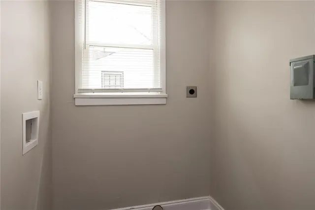 a kitchen with a white cabinets sink and white appliances