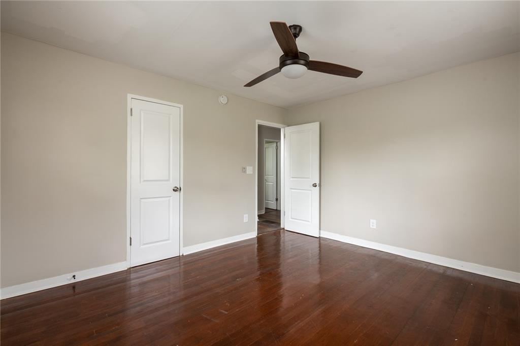 1854 Broadwell Street Southwest Atlanta, GA 30310 - Photo 17 of 18 a view of an empty room with wooden floor