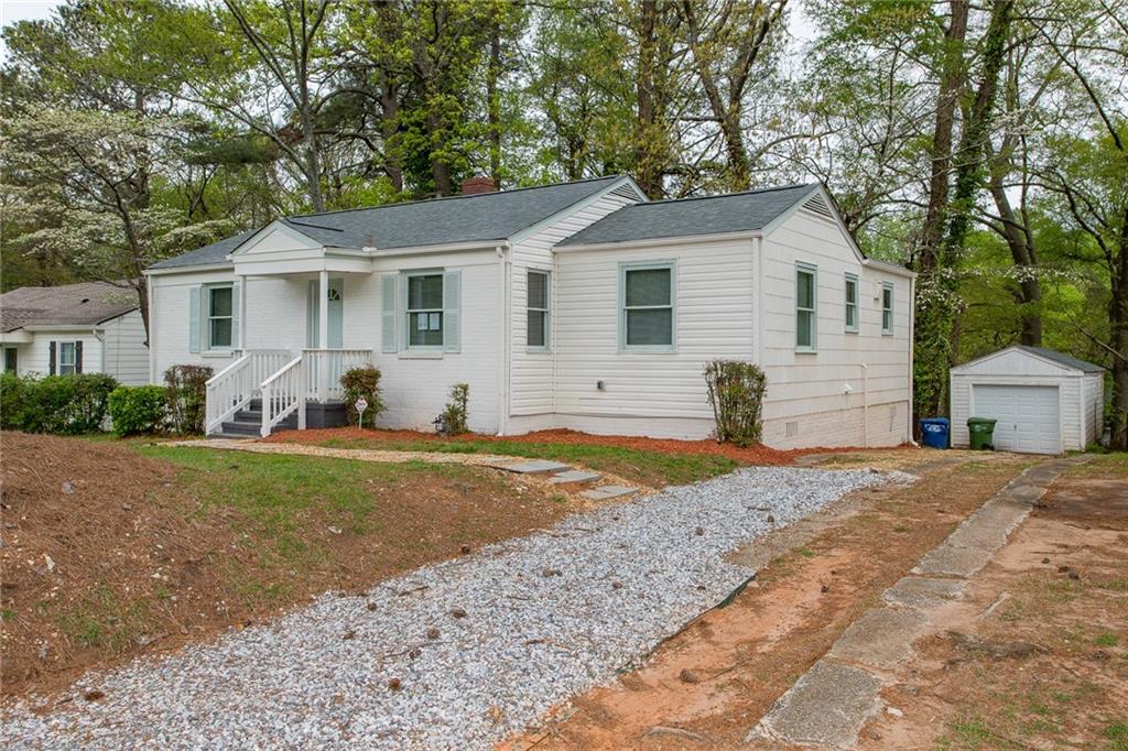 1854 Broadwell Street Southwest Atlanta, GA 30310 - Photo 3 of 18 a view of a yard in front of a house with large trees