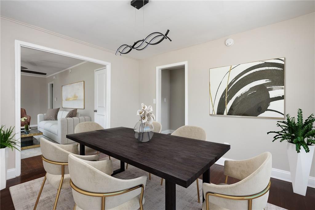 1854 Broadwell Street Southwest Atlanta, GA 30310 - Photo 8 of 18 a view of a dining room with furniture and wooden floor