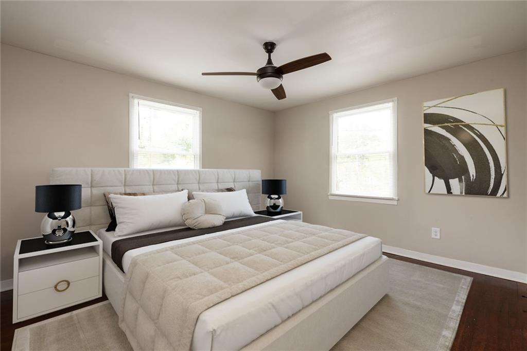 1854 Broadwell Street Southwest Atlanta, GA 30310 - Photo 10 of 18 a bedroom with a bed and a window