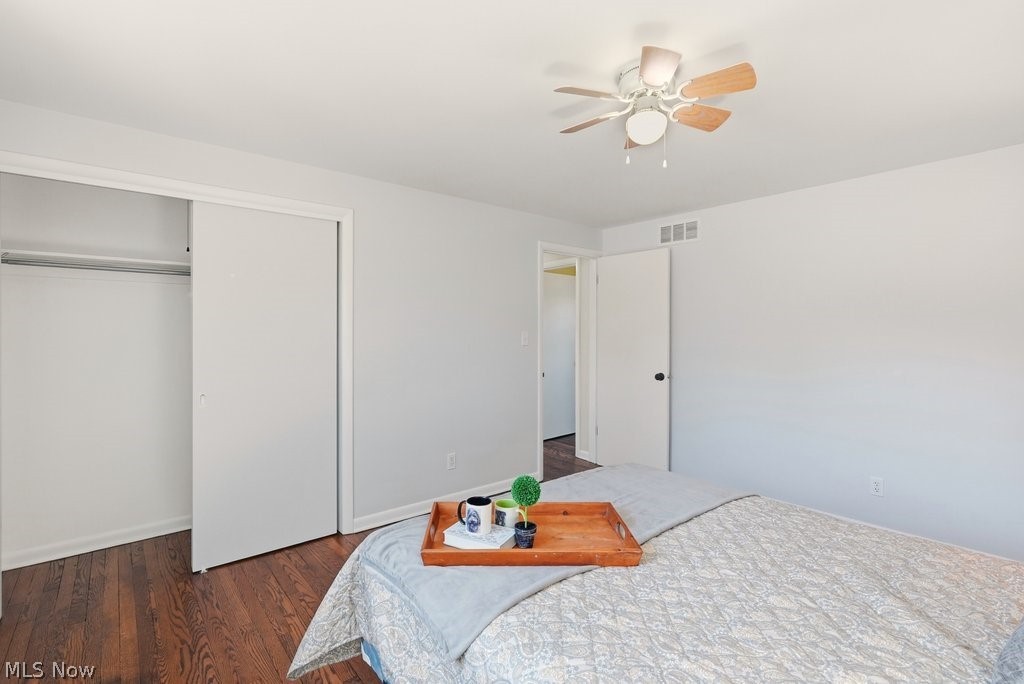 4699 West Bath Road Akron, OH 44333 - Photo 25 of 50 Bedroom featuring closet, fan, hard wood floors.