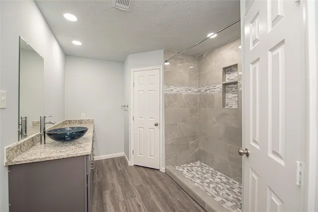 a bathroom with a sink and a mirror