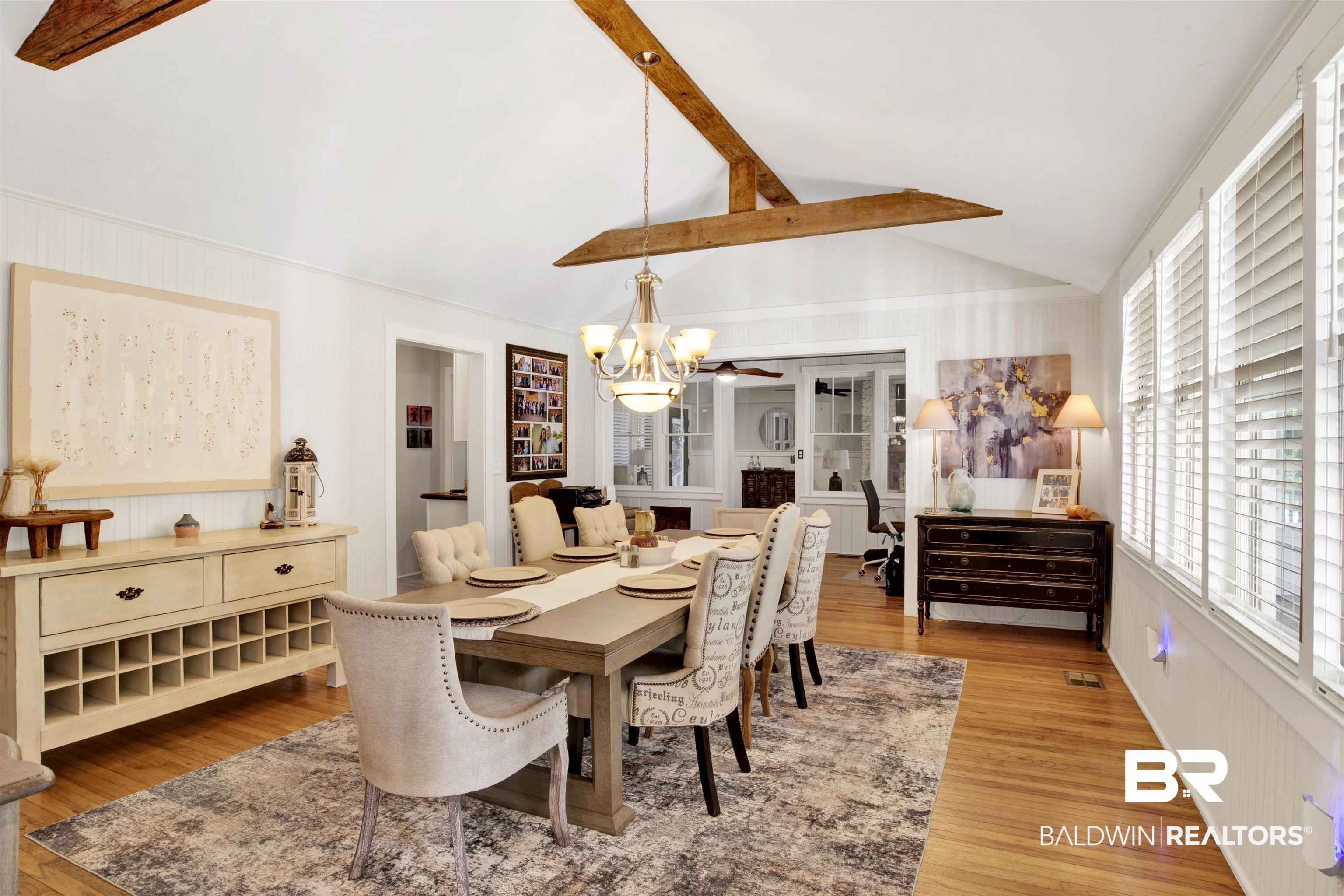 605 Van Avenue Daphne, AL 36526 - Photo 5 of 37 Dining room with a notable chandelier, lofted ceiling with beams, and wood-type flooring