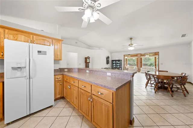 a living room with furniture and large windows